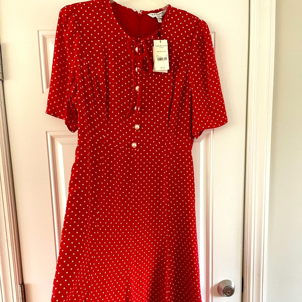Brand new with tags. Size is too big now. Pearl button detail.